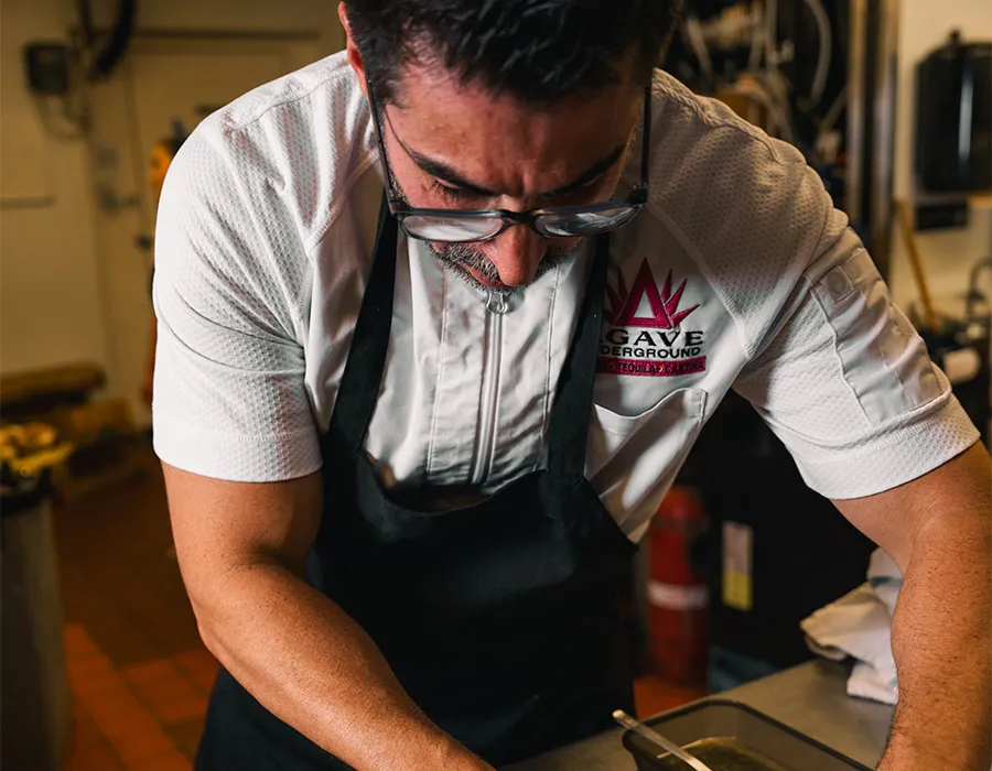 Chef plating dishes in the kitchen during a special dinner