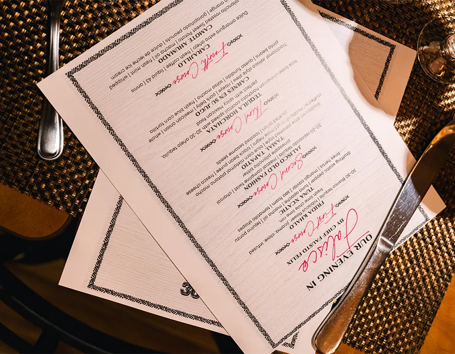 Printed tasting menu for a special evening on the table