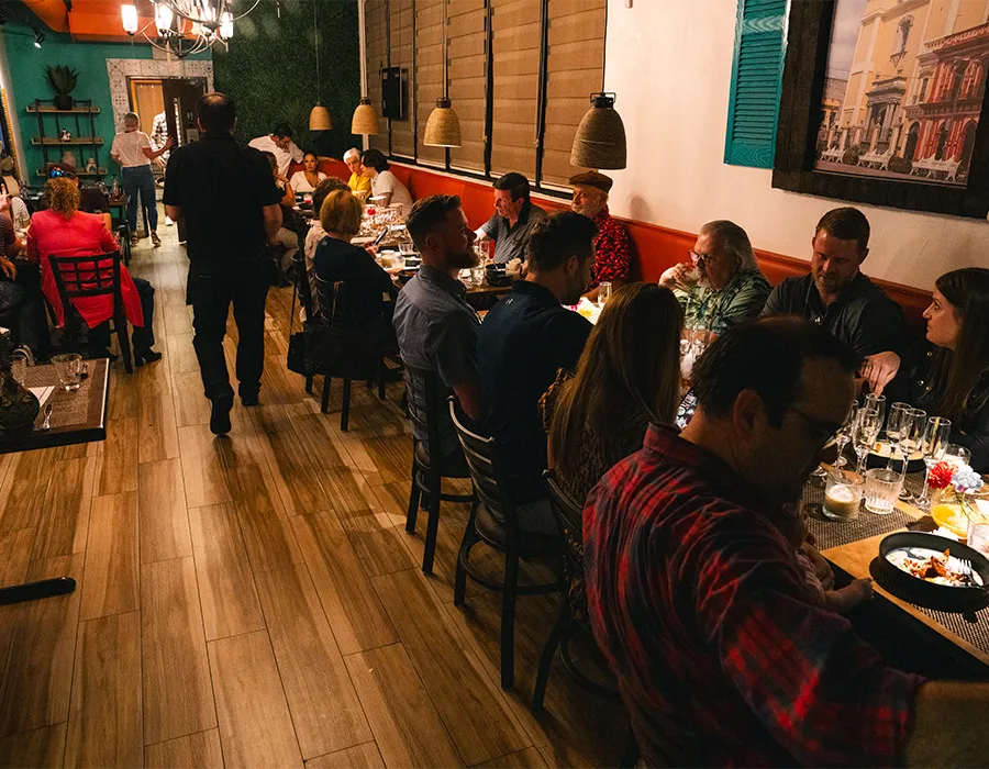 Busy dining room full of guests during a dinner event