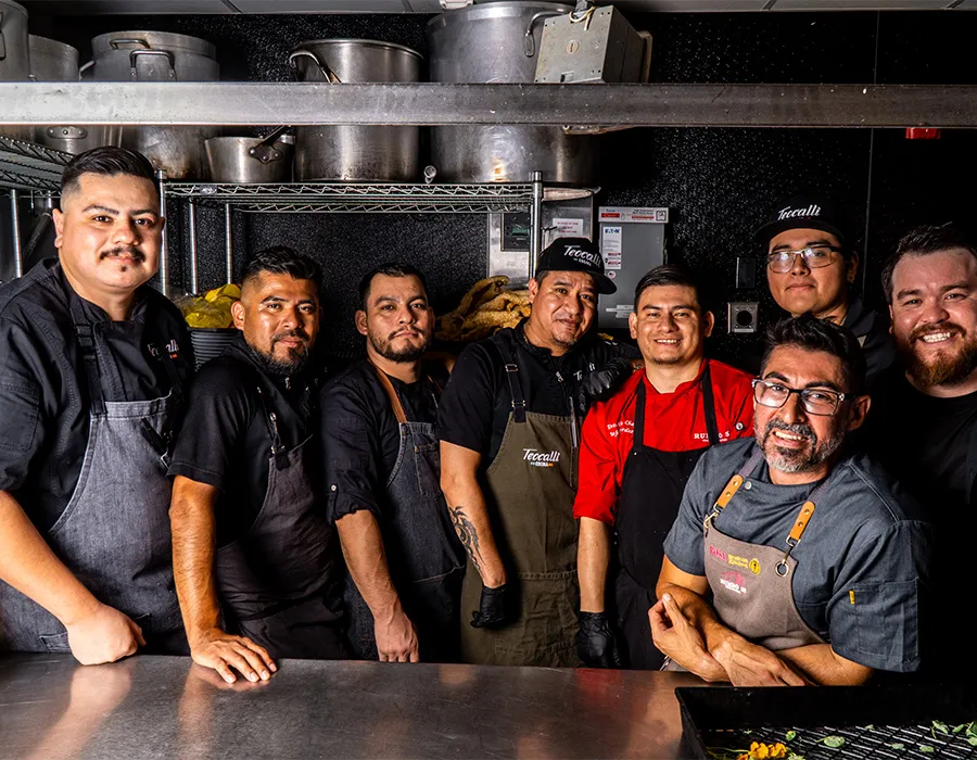 Rumbo 52 kitchen team posing together in the kitchen
