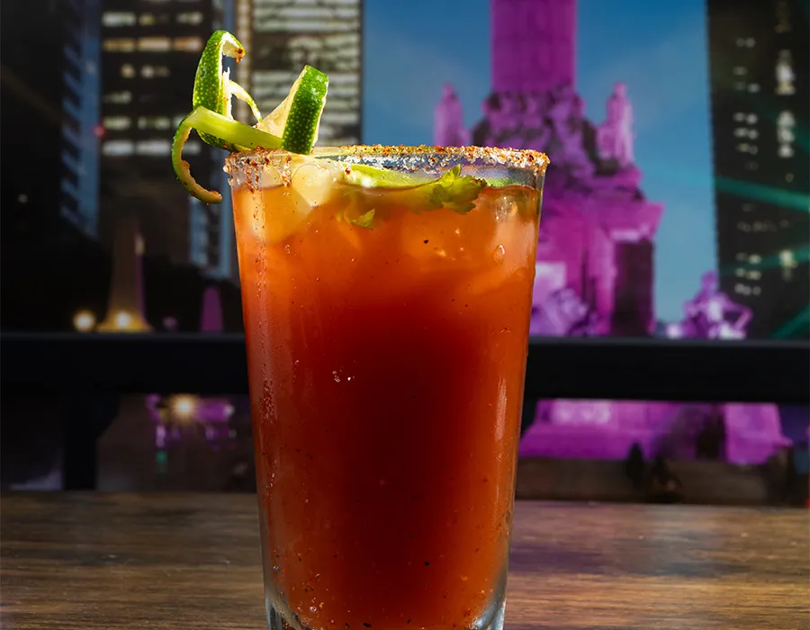 Michelada with a chile-salt rim and fresh lime garnish